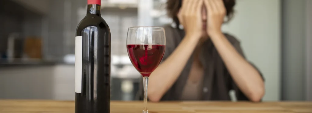 Woman with wine worried