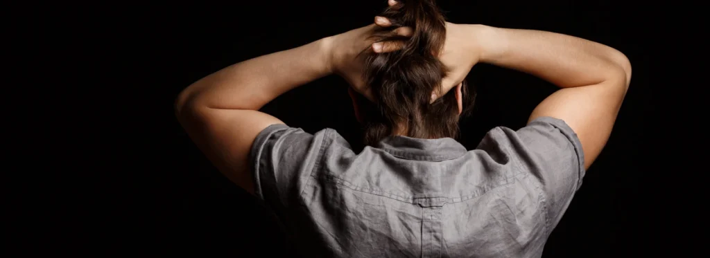 Man with hands on head